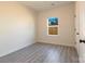 Neutral bedroom offering hard-surface floors and a window overlooking a wood fence at 713 E Third Ave, Gastonia, NC 28054