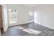 Bright bedroom with hard-surface floors and windows allowing for ample natural light at 713 E Third Ave, Gastonia, NC 28054