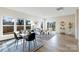 Open concept dining room with modern furnishings, large windows, and bright natural light at 713 E Third Ave, Gastonia, NC 28054