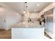 Spacious kitchen island with granite countertops, pendant lights, and barstool seating at 713 E Third Ave, Gastonia, NC 28054