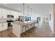 Modern kitchen with stainless steel appliances, granite countertops, a large island with bar seating, and pendant lighting at 713 E Third Ave, Gastonia, NC 28054