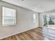 Bright open living area with lots of windows and glass sliding doors to the backyard at 8023 Downy Oak Ln, Charlotte, NC 28269