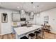 Modern kitchen featuring gray cabinets, quartz countertops, pendant lighting, and stainless steel appliances at 8027 Downy Oak Ln, Charlotte, NC 28269