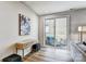 Bright living room featuring hardwood floors, stylish decor, and sliding doors to an outdoor patio at 8027 Downy Oak Ln, Charlotte, NC 28269