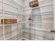 Walk-in pantry with white wire shelving and woven baskets for storage at 8027 Downy Oak Ln, Charlotte, NC 28269