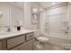 Bathroom featuring a vanity with light gray cabinets and tub with shower at 8031 Downy Oak Ln, Charlotte, NC 28269