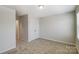 Bedroom with neutral carpet, double closets and a window for natural light at 8031 Downy Oak Ln, Charlotte, NC 28269