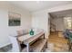 Charming dining area with wood flooring, a rustic table and chairs, plus a bench for extra seating at 8031 Downy Oak Ln, Charlotte, NC 28269
