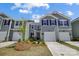 Charming townhome with gray siding, black shutters, and well-maintained landscaping at 8031 Downy Oak Ln, Charlotte, NC 28269