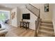 Hallway featuring staircase, mounted TV, and adjacent dining area with an airy and open feel at 8031 Downy Oak Ln, Charlotte, NC 28269