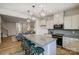 Modern kitchen with granite countertops, stainless steel appliances, and stylish pendant lighting at 8031 Downy Oak Ln, Charlotte, NC 28269