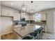 Modern kitchen with granite countertops, stainless steel appliances, and stylish pendant lighting at 8031 Downy Oak Ln, Charlotte, NC 28269
