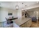 Open-concept kitchen with granite countertops, stainless steel appliances, and wood floors at 8031 Downy Oak Ln, Charlotte, NC 28269