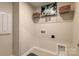 Utility room featuring tile flooring, washer/dryer hookups and shelving at 8031 Downy Oak Ln, Charlotte, NC 28269