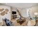 Comfortable living room with modern decor, wood floors, and an open layout at 8031 Downy Oak Ln, Charlotte, NC 28269