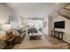 Inviting living room with a neutral color palette, wood floors, and an open layout at 8031 Downy Oak Ln, Charlotte, NC 28269