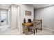 Cozy upstairs office nook with a wooden desk and chair, perfect for a small workspace at 8035 Downy Oak Ln, Charlotte, NC 28269