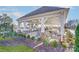 Outdoor pavilion with dining tables and chairs overlooking the pool and landscaped grounds at 8035 Downy Oak Ln, Charlotte, NC 28269