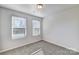 This bedroom features two windows that let in plenty of natural light, enhancing its welcoming atmosphere at 8039 Downy Oak Ln, Charlotte, NC 28269