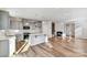 Modern open-concept kitchen featuring an island and seamlessly connects to living area at 8039 Downy Oak Ln, Charlotte, NC 28269