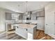 Modern kitchen features an island, stainless steel appliances, and ample counter space at 8039 Downy Oak Ln, Charlotte, NC 28269