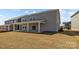 Large backyard with a covered patio, perfect for outdoor entertaining and relaxation at 845 Regulus Ct, York, SC 29745