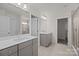 Elegant bathroom with double vanities, mirrors, and access to a shower room at 845 Regulus Ct, York, SC 29745