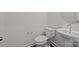 A minimalist half-bathroom featuring a pedestal sink and toilet in a bright space at 845 Regulus Ct, York, SC 29745