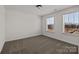Inviting bedroom featuring neutral carpeting and two bright windows offering plenty of natural light at 845 Regulus Ct, York, SC 29745