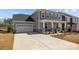 Charming home with a long driveway leading to a two-car garage and a welcoming porch at 845 Regulus Ct, York, SC 29745