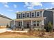 Charming two-story home with a welcoming porch and classic architectural details at 845 Regulus Ct, York, SC 29745