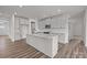 Spacious kitchen with a large center island, white cabinets, and a modern design at 845 Regulus Ct, York, SC 29745