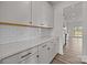 Modern kitchen featuring white cabinets, white subway tile, and quartz countertops at 845 Regulus Ct, York, SC 29745