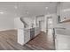 Open kitchen concept with a large island, stainless steel appliances, and wood flooring at 845 Regulus Ct, York, SC 29745