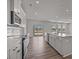 Modern kitchen with stainless steel appliances, an island sink, and hardwood floors at 845 Regulus Ct, York, SC 29745