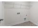 Bright laundry room featuring tiled floors and preinstalled washer/dryer hookups for easy appliance installation at 845 Regulus Ct, York, SC 29745