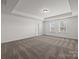 Carpeted main bedroom boasts a tray ceiling and bright windows, offering lots of natural light at 845 Regulus Ct, York, SC 29745