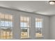 A trio of windows provide scenic views of the outdoors, filling the room with natural light at 845 Regulus Ct, York, SC 29745