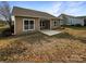 Spacious backyard featuring a patio and green grass at 8804 Artesa Mill Ln, Charlotte, NC 28214