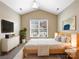 Cozy bedroom with vaulted ceiling, neutral colors, carpet, and large windows with plenty of natural light at 8804 Artesa Mill Ln, Charlotte, NC 28214