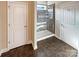 Bathroom showcasing tiled walk-in shower with glass door and tile flooring at 8804 Artesa Mill Ln, Charlotte, NC 28214
