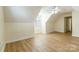 Bright bedroom featuring wood floors, a ceiling fan, and natural light from window at 10034 Wild Dogwood Ct, Charlotte, NC 28273