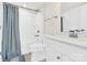 Bright bathroom with white vanity, shower-tub combo, and modern fixtures at 112 August Ln, Matthews, NC 28104