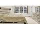Neutral bedroom with carpet floors, sleek modern furnishings, curtains, and a large window for natural light at 112 August Ln, Matthews, NC 28104