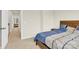 Comfortable bedroom with a cozy bed, neutral walls, and interior hallway access at 112 August Ln, Matthews, NC 28104