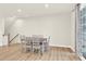 This dining room features a dining table, hardwood floors and neutral walls, creating an inviting atmosphere at 112 August Ln, Matthews, NC 28104