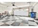 Spacious garage interior featuring a checkerboard floor and ample storage space at 112 August Ln, Matthews, NC 28104