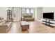This cozy living room features hardwood floors, natural light, and a TV, creating a welcoming atmosphere at 112 August Ln, Matthews, NC 28104