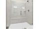 Modern tiled shower with glass door and built-in seat at 112 August Ln, Matthews, NC 28104