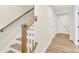 Beautiful staircase with wooden handrail and view of laminate flooring at 112 August Ln, Matthews, NC 28104